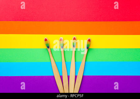 Photo on top of four toothbrushes located in center . Stock Photo