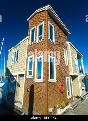 House on the water. Economical living in the overcrowded city. Stock Photo