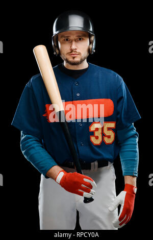 Baseball player posing with bat Stock Photo