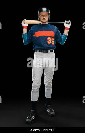 Baseball player posing on black Stock Photo