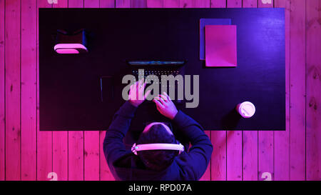 Top view.Young Pro Gamer Playing in Online Video Game Loses Big Tournament and is Disappointed. Professional shot in 4K resolution. 020. You can use i Stock Photo