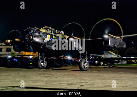 Lancaster 'Just Jane' does a night taxy run at the Lincolnshire Aviation Heritage Centre, East Kirkby in November 2014. Stock Photo