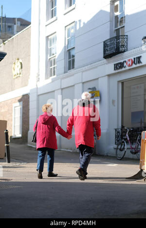 A retired couple holding hands in Falmouth, Cornwall Stock Photo