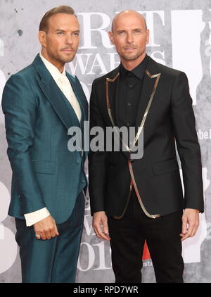 Matt and Luke Goss - Bros are seen on the red carpet during The BRIT Awards 2019 at The O2, Peninsula Square in London. Stock Photo