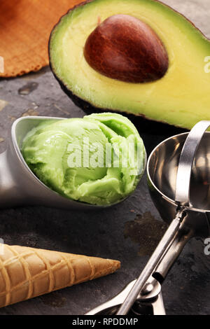 Homemade Green Organic Avocado Ice Cream Ready to Eat. Hass avocado icecream Stock Photo