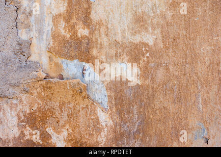 Old Cracked Weathered Shabby Yellow Painted Plastered Peeled Wall Background. Stock Photo