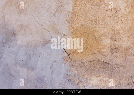 Old plastered painted in two colors wall texture background Stock Photo