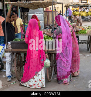 Women buying vegetables from market, Jaisalmer, Rajasthan, India Stock Photo