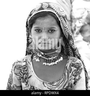 Portrait of local tribal woman in traditional attire, Sam Sand Dunes, Damodara, Jaisalmer, Rajasthan, India Stock Photo