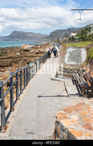 Coastal footpath running from Muizenberg to St James following the rocky coastline of False Bay in Cape Peninsula, South Africa Stock Photo