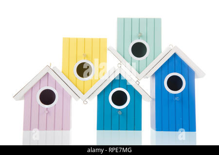 Many colorful bird boxes isolated over white background Stock Photo