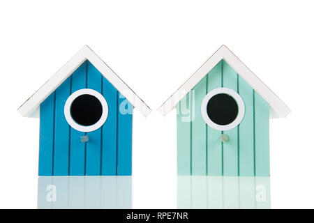 Many colorful bird boxes isolated over white background Stock Photo