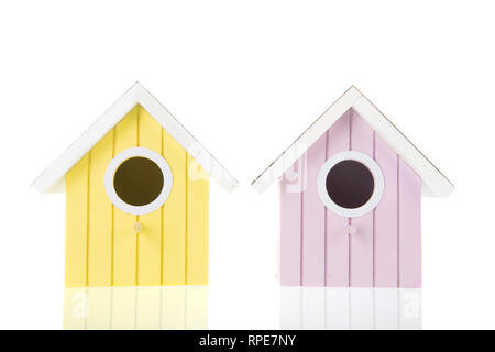 Many colorful bird boxes isolated over white background Stock Photo