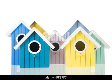 Many colorful bird boxes isolated over white background Stock Photo