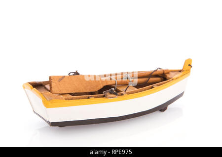 Wooden rowing boat with oars isolated over white background Stock Photo