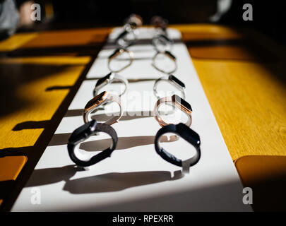 PARIS, FRANCE - OCT 26, 2018: Hero object of the latest Apple Watch Series 4 in Apple Store Computers - focus on gold aluminum watch Stock Photo