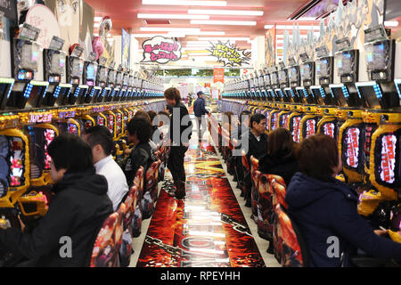 OSAKA, JAPAN - DECEMBER 05, 2016: Unidentified japanese people playing pachinko in Osaka, Japan Stock Photo