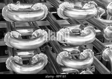 Stainless steel pipes in the factory. Construction on food production, Abstract industry background. Stock Photo