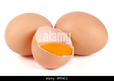 two whole eggs and broken egg isolated on white background Stock Photo