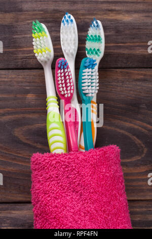 toothbrushes on the black wooden background Stock Photo