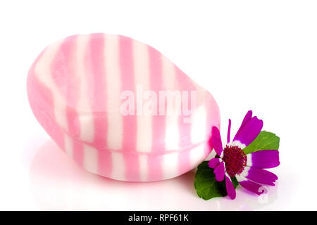 White pink striped soap with a flower isolated on white background Stock Photo