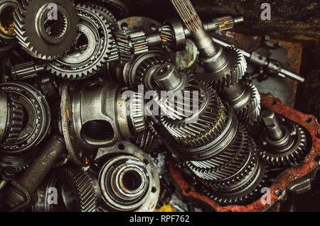 A lot of broken gears and shafts in the garbage box Stock Photo