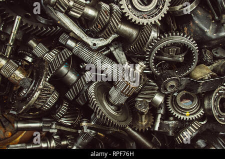 A lot of broken gears and shafts in the garbage box Stock Photo