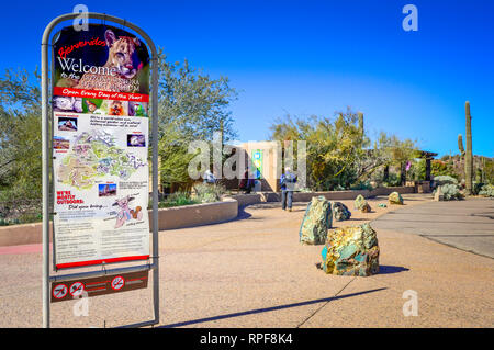 An informational signboard welcomes visitors in front of the Arizona-Sonora Desert Museum entrance in Tucson, AZ, USA Stock Photo