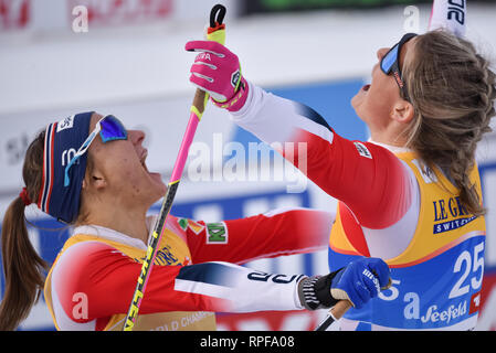 Seefeld, Austria. 21st Feb, 2019. Norway's Maiken Caspersen Falla (left) and Mari Eide rush to embrace after the final in the 1.2-kilometer women's freestyle sprint race at the 2019 world nordic ski championships. Falla won; Eide was third. Credit: John Lazenby/Alamy Live News Stock Photo