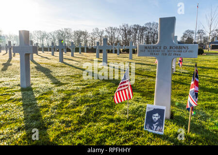 A flypast of US and RAF aircraft has been organised to fly over the crash site of B-17 bomber 'Mi Amigo' for the 75th anniversary of the event in Sheffield. The USAF F-15 fighters continued on to the Cambridge American Cemetery at which 3 of the 10 man crew are interred. Staff Sgt Harry W Estabrooks, Sgt Maurice D Robbins and Sgt Charles H Tuttle were remembered in a ceremony at the cemetery prior to the flypast.  Their inscriptions highlighted with sand from Normandy Beaches. Other 7 crew returned to US Stock Photo