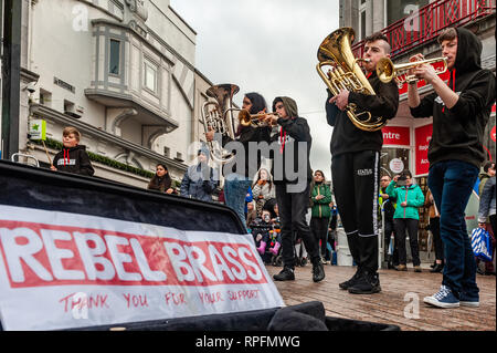 Cork, Ireland. 22nd Feb, 2019. Cork based brass band 'Rebel Brass' played in Cork city centre in front of huge crowds today. The band, made up of 12 to 18 year old young people, played on the Late Late Toy Show in November. Credit: Andy Gibson/Alamy Live News. Stock Photo