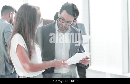 boss and assistant to discuss the work schedule Stock Photo