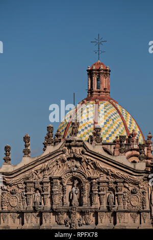 The tiled dome on the Baroque Churrigueresque style Iglesia del Carmen church and convent in the historic center on the Plaza del Carmen in the state capital of San Luis Potosi, Mexico. Stock Photo