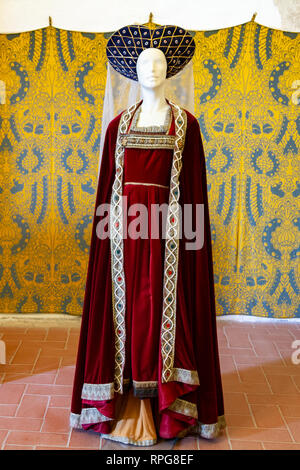 Dark red Medieval velvet costume of a Hungarian queen, exhibited in Visegrád, Hungary Stock Photo