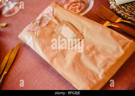 Rectangular gift wrapped in paper with empty label to fill, copy space. Stock Photo
