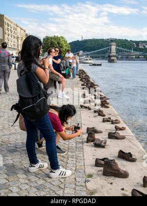 The Shoes on the Danube Bank memorial in Budapest. At this spot people were ordered to take of their shoes and then shot, falling into the river, duri Stock Photo