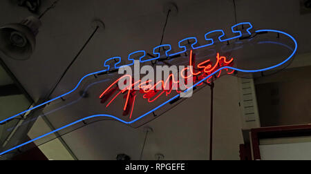 Fender Neon Sign in a music instruments store, in blue and red Stock Photo