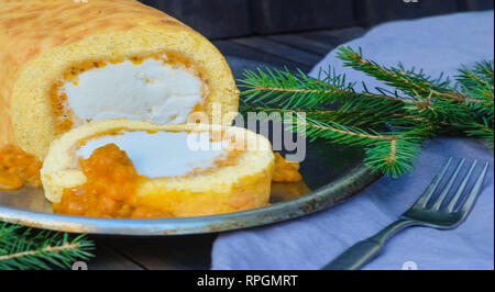 Swiss roll tart with vanilla ice cream and jam filling. The ice cream cake is also called the Arctic Roll. Stock Photo