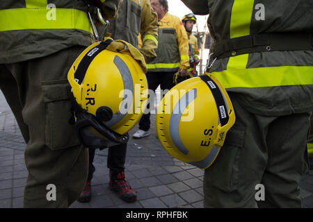 Forest fire-fighters are seen wearing their uniforms and helmets during the protest Forest fire-fighters protest in front of the Assembly of Madrid to demand a decent collective agreement to the Community of Madrid, the recognition of the category of forest fire-fighter should be a 100% public work or the reinstatement of co-workers dismissed by Infosa should in charge of the forest fire-fighters of the south zone of Madrid for example. Stock Photo