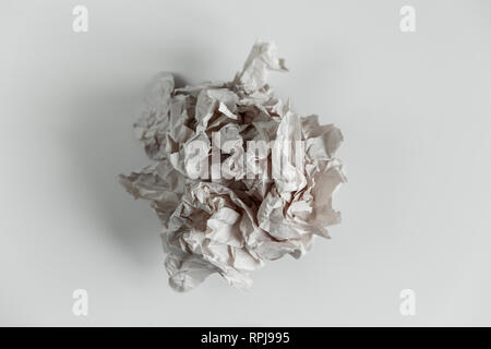 Crumpled paper ball isolated on white with clipping path. Stock Photo