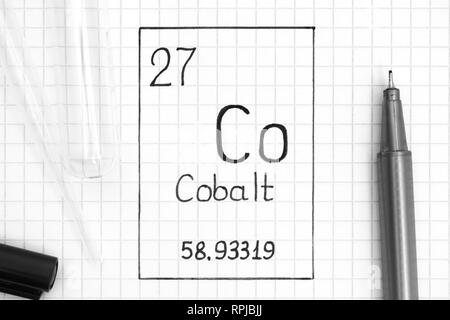 The Periodic table of elements. Handwriting chemical element Cobalt Co with black pen, test tube and pipette. Close-up. Stock Photo