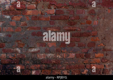 Background of red brick wall pattern texture. Great for graffiti inscriptions. Stock Photo