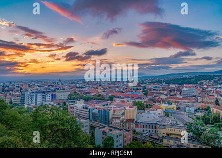 Cluj city overview at sunrise from Cetatuia Hill in Cluj-Napoca, Romania Stock Photo