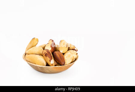 Bowl of Brazil nuts (Bertholletia excelsa) on a white background Stock Photo