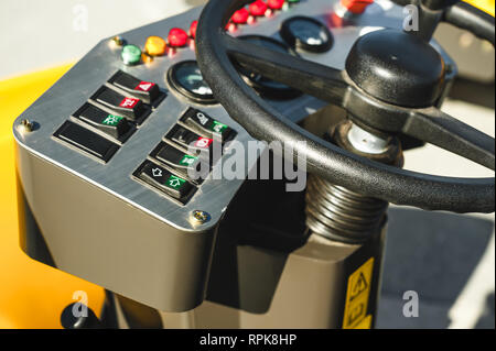 Industrial Vehicle. Heavy Construction Equipment Machine.  asphalt roller, view inside the cabin interior controls Stock Photo