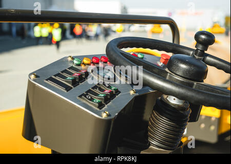 Industrial Vehicle. Heavy Construction Equipment Machine.  asphalt roller, view inside the cabin interior controls Stock Photo