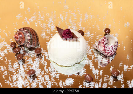 white chocolate mousse cake on a mirror with crushed ice with a clear background Stock Photo