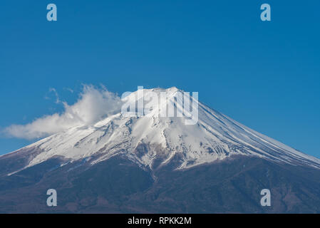 Close-up snow covered Mount Fuji ( Mt. Fuji ) in clear blue sky background on sunny winter season. Fujiyoshida City, Yamanashi Prefecture, Japan Stock Photo