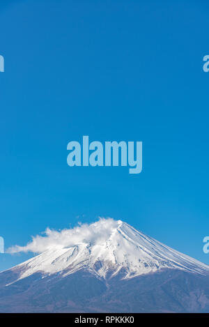 Close-up snow covered Mount Fuji ( Mt. Fuji ) in clear blue sky background on sunny winter season. Fujiyoshida City, Yamanashi Prefecture, Japan Stock Photo