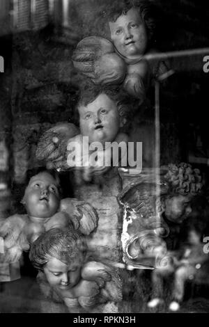 NAPLES - Cherubs in a shop window in the historical center. Stock Photo